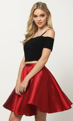 A woman stands against a plain background wearing the Juliet 809 short party dress, featuring off-the-shoulder sleeves and a shiny red A-line skirt.