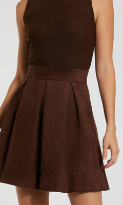 Wearing the Mac Duggal 81071 Short Brown Wedding-Guest Dress, a person stands against a plain background.