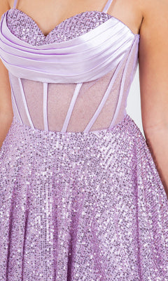A close-up of a woman wearing the Cowl-Neck Short Sequin Homecoming Dress 8126J—a lavender, sleeveless party dress with a sequined skirt, sheer mesh bodice, and satin cowl neckline.