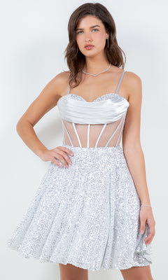 A woman stands against a plain white background wearing the Cowl-Neck Short Sequin Homecoming Dress 8126J, featuring a sheer corset-style bodice.
