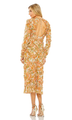 Woman wearing the Mac Duggal 8134 Orange Print Wedding Guest Dress with long sleeves, open back, and ruffled hem, paired with metallic heels—a chic floral midi dress perfect for wedding guests.