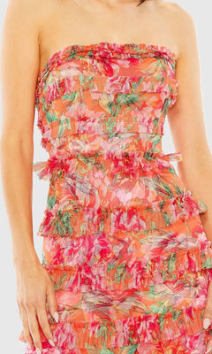 Woman wearing a strapless floral dress with a white background