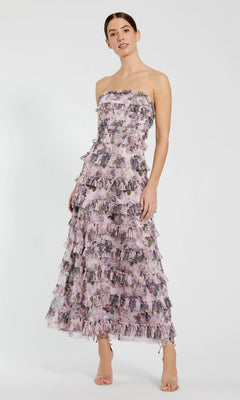 Woman wearing a strapless floral dress on a white background