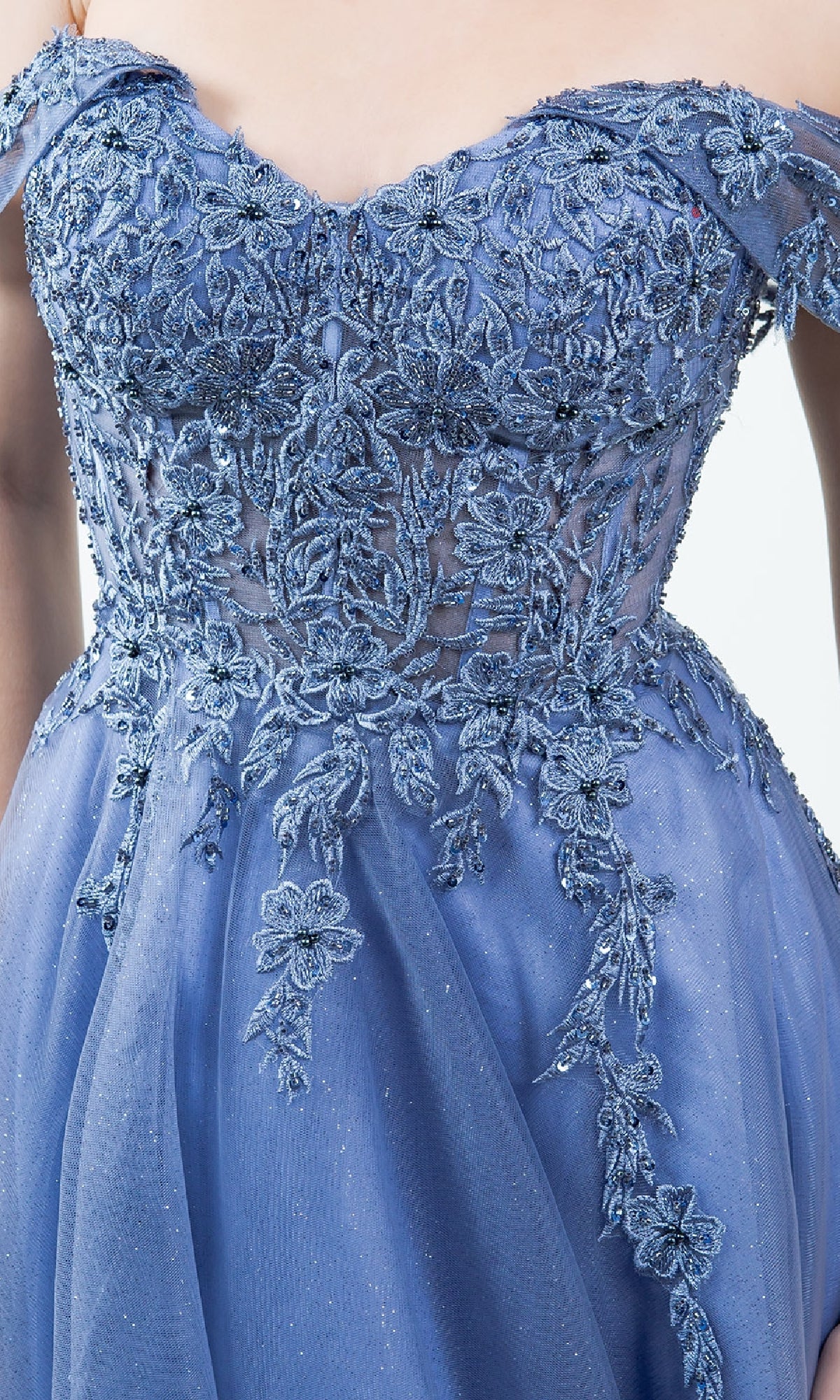 A close-up of the Long Prom Ball Gown: Cinderella Couture 8152J, a blue off-the-shoulder dress with intricate floral lace embroidery and beaded bodice, perfect as an elegant long A-line formal gown.