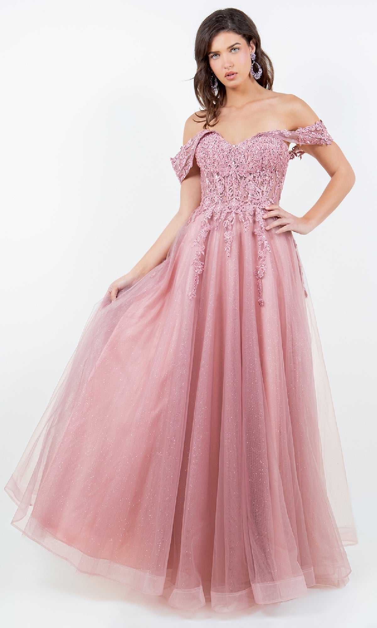 Woman wearing the Cinderella Couture 8152J long prom ball gown, featuring a pink off-the-shoulder design with lace and beaded bodice details and a flowing tulle skirt.