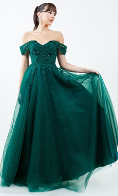 A woman models the Cinderella Couture 8152J, a long prom ball gown featuring an off-the-shoulder design and sparkling tulle skirt in dark green, styled floor-length against a plain white background.
