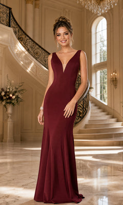 A woman models the Sleeveless V-Neck Long Formal Prom Dress 8158 in burgundy, standing in an elegant room with a grand staircase and large windows behind her.