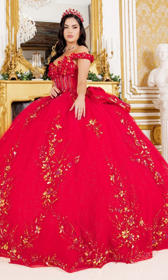 A woman stands in an ornate room wearing the Cinderella Couture 8160J off-the-shoulder red quinceanera ball gown with gold floral embroidery and a matching headpiece.