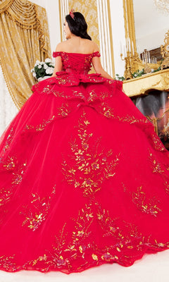 A woman faces away from the camera in an elegant gold-decorated room, wearing the Cinderella Couture 8160J quinceanera dress—an ornate red ball gown adorned with gold embroidered lace appliques.