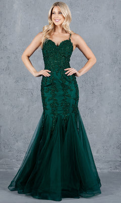 A woman in the Cinderella Couture 8175J lace-up long prom dress stands before a gray textured background.