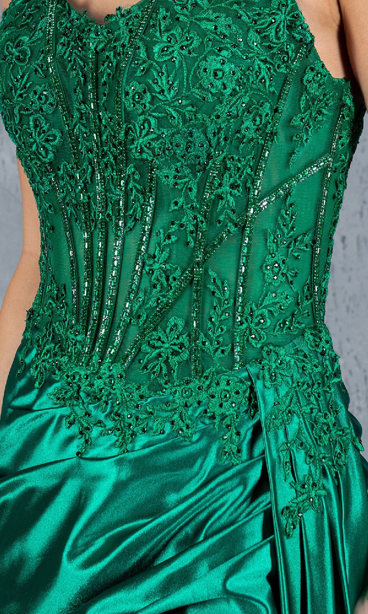 Close-up of the Cinderella Couture 8177J Long Corset Prom Dress in green satin and lace, showcasing intricate beadwork, embroidery, and a beaded corset bodice with visible boning.