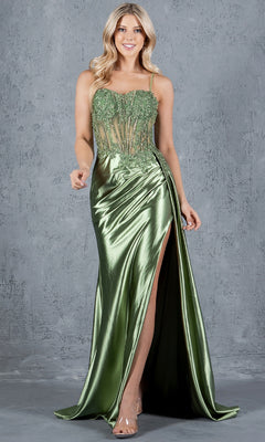A woman wearing the Long Corset Prom Dress: Cinderella Couture 8177J, a shiny green gown with a beaded corset bodice and thigh-high slit, stands against a gray textured wall.