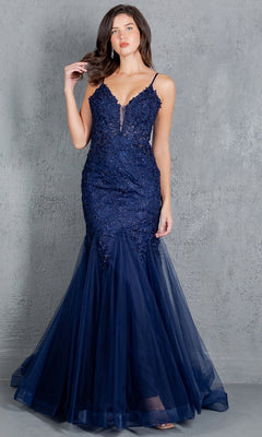 A woman stands against a gray textured background, wearing the Cinderella Couture 8178J: a navy blue, floor-length mermaid prom dress with lace, tulle details, and beaded embroidery.