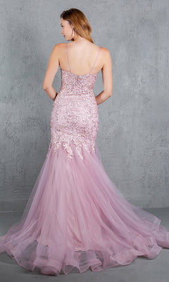 A woman wearing the Beaded Long Prom Dress: Cinderella Couture 8178J in light purple, featuring lace detail, beaded embroidery, and thin straps, stands with her back to the camera against a plain gray wall.