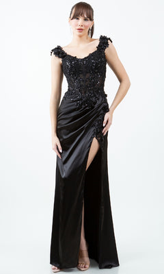 A woman models the Sparkly Long Prom Dress: Cinderella Couture 8181J—a sleeveless, black, floor-length gown with floral embellishments and a high slit—standing against a plain white background.