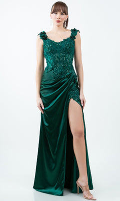 A woman wearing the Sparkly Long Prom Dress: Cinderella Couture 8181J in emerald green with floral embroidery and a high slit, styled with nude heels. This affordable gown makes a stunning statement for any special occasion.