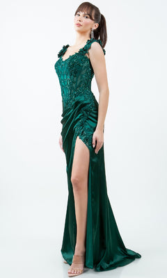 A woman models the Sparkly Long Prom Dress: Cinderella Couture 8181J, featuring floral embroidery and a high slit, paired with high-heeled sandals against a plain white background.