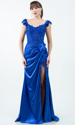 A woman wearing the Sparkly Long Prom Dress: Cinderella Couture 8181J in bright blue, featuring an off-the-shoulder design, floral appliqués, bead embellishments, and a thigh-high slit.