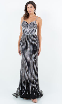 A woman wears the Cinderella Couture 8203J Bead-Striped Prom Gown—floor-length, black with silver vertical stripes and thin straps—against a plain white background.