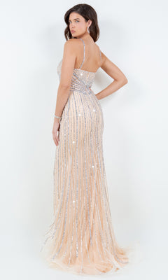 A woman models the Bead-Striped Prom Gown: Cinderella Couture 8203J, a sleeveless floor-length nude dress with silver sequin stripes—perfect for prom or special occasions—posing elegantly against a plain white background.
