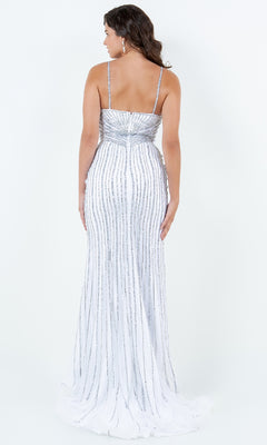 A woman faces away, modeling the Bead-Striped Prom Gown: Cinderella Couture 8203J with silver vertical sequins and thin straps, set against a plain white background.