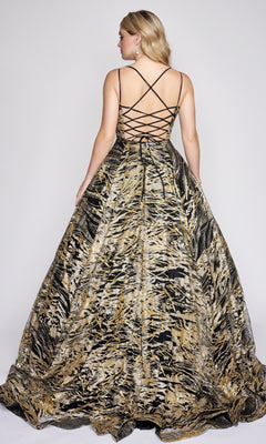Woman wearing the Nina Canacci 8209 Print Prom Ball Gown in gold and black with a crisscross lace-up back, standing and facing away from the camera.