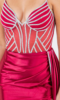 A woman wears the Cinderella Couture 8219J Side-Sash Long Prom Gown—a plus size red formal dress with a fitted sleeveless bodice, sheer mesh, silver sequin accents, and a draped satin skirt.