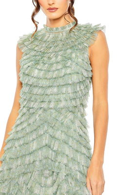 A woman stands against a white background wearing the sleeveless light green Mac Duggal 8225 Midi Ruffled Wedding Guest Dress, featuring layered ruffles.