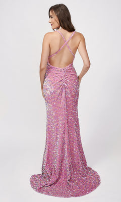 Woman in a floor-length Nina Canacci 8233 pink sequin dress with v-neckline, open back, and crisscross straps, standing against a plain white background.