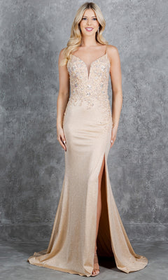 A woman stands against a gray textured backdrop wearing the Cinderella Couture 8255J, a long glitter prom dress featuring a beaded bodice, thin straps, and a high slit.