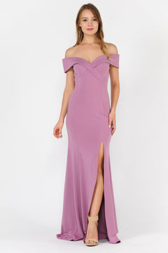 A woman in the Classic Off-the-Shoulder Formal Prom Dress 8258, mauve with a front slit, paired with nude high-heeled sandals, stands against a plain white background.