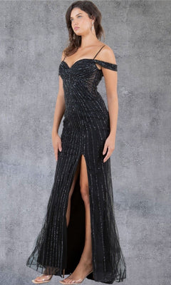 A woman wearing the Cinderella Couture 8269J long prom dress in black, featuring thin straps, silver vertical stripes, an off-shoulder neckline, and a floor-length silhouette with a front thigh-high slit, stands against a gray textured background.