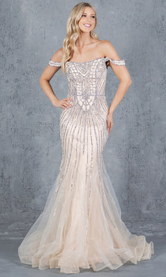 A woman models the Cinderella Couture 8271J, a long beaded prom dress with intricate details and a tulle mermaid skirt, standing against a gray textured backdrop to showcase its elegant design.