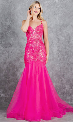A woman wearing the Cinderella Couture 8276J, a bright pink, sleeveless, sequin mermaid-style prom dress, stands before a gray textured backdrop.