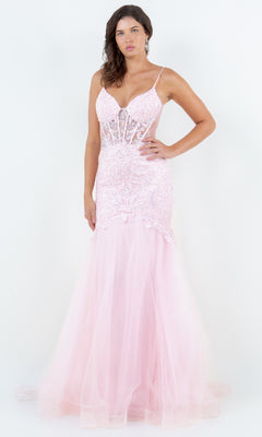 A woman models the Cinderella Couture 8276J, a light pink long mermaid prom dress with thin straps, lace details, and a sheer flared skirt, standing against a plain white background.