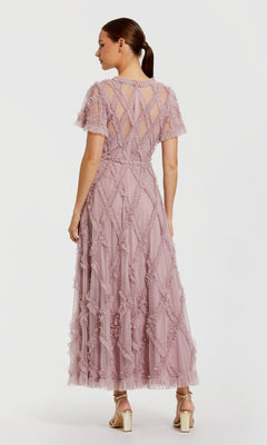 Woman wearing a pink dress on a white background