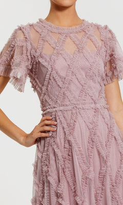Pink ruffled dress with a white background