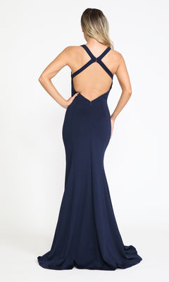 A woman stands facing away, wearing the Simple Sleeveless Long Jersey Prom Dress 8298—a floor-length, dark blue gown with a fitted silhouette, open back, and crisscross straps.