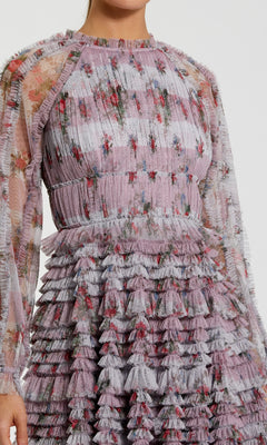 Close-up of a floral dress with ruffled layers on a plain background