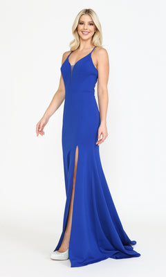 A woman in the Open-Back V-Neck Long Simple Jersey Prom Dress 8360 in royal, featuring a floor-length skirt, sleeveless cut, v-neckline, and thigh-high slit, stands smiling against a plain white background.