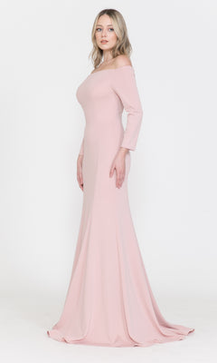 A woman models the Off-the-Shoulder Long-Sleeve Formal Prom Dress 8378, a fitted, floor-length gown in light pink, against a plain white background.