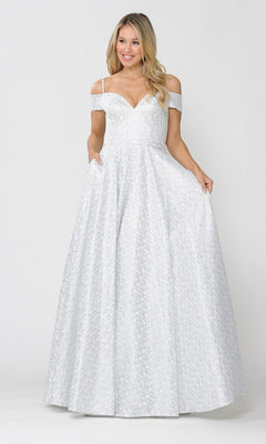 A woman smiles while posing in the Cold-Shoulder Silver and White Long Prom Gown 8380, an off white and silver evening dress, against a plain background, holding the sides of her gown.