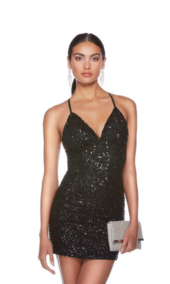 Woman wearing the Alyce Empire-Waist Short Sequin Hoco Dress 84000 in black, matched with silver earrings and a silver clutch, poses against a plain white background.