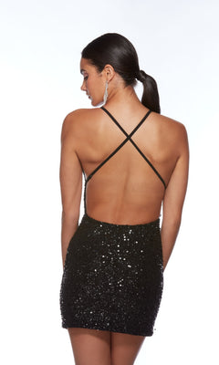 A woman faces away in the Alyce Empire-Waist Short Sequin Hoco Dress 84000, featuring black sequins and crisscross open-back straps, her hair in a ponytail, set against a white background.
