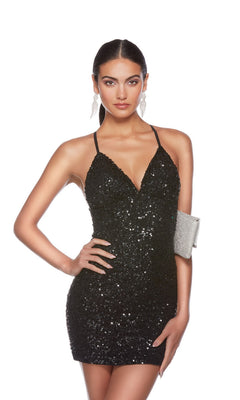 Woman wearing the Alyce Empire-Waist Short Sequin Hoco Dress 84000 in black, holding a silver clutch, standing against a plain white background.