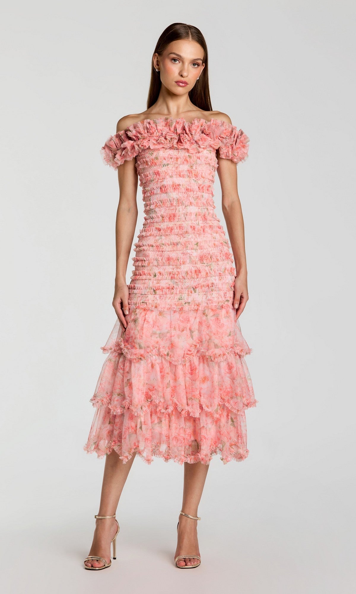 A woman wearing the Midi Party Dress: Mac Duggal 8432—a ruffle tiered, blush multi, off-the-shoulder midi dress—stands against a plain light background.