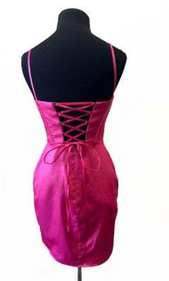 The Cowl-Neck Corset Homecoming Dress: Aerie Couture 843, in pink satin with lace-up open back and spaghetti straps, is shown from behind on a black dress form against a white background.