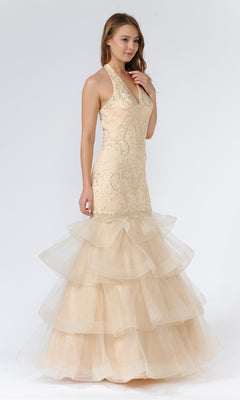 A woman in the Beaded Long Halter Mermaid Tiered Prom Dress 8466, featuring a sleeveless beaded bodice and tiered tulle skirt, stands against a plain white background.