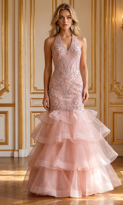 A woman wearing the Beaded Long Halter Mermaid Tiered Prom Dress 8466 in mauve, featuring intricate beaded embellishments and a tiered tulle skirt, stands in an ornate room with gold trim and a wooden floor.