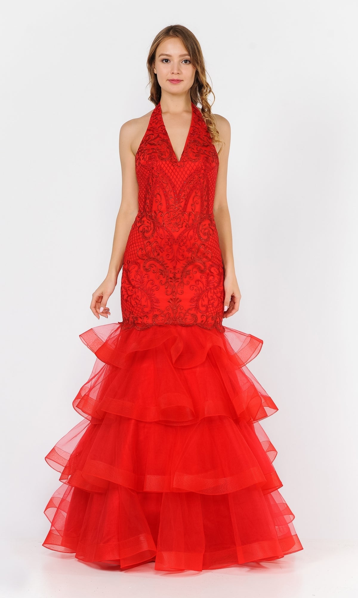 A woman models the Beaded Long Halter Mermaid Tiered Prom Dress 8466 in red, featuring a lace-detailed beaded bodice and tiered tulle ruffles, standing against a plain white background.